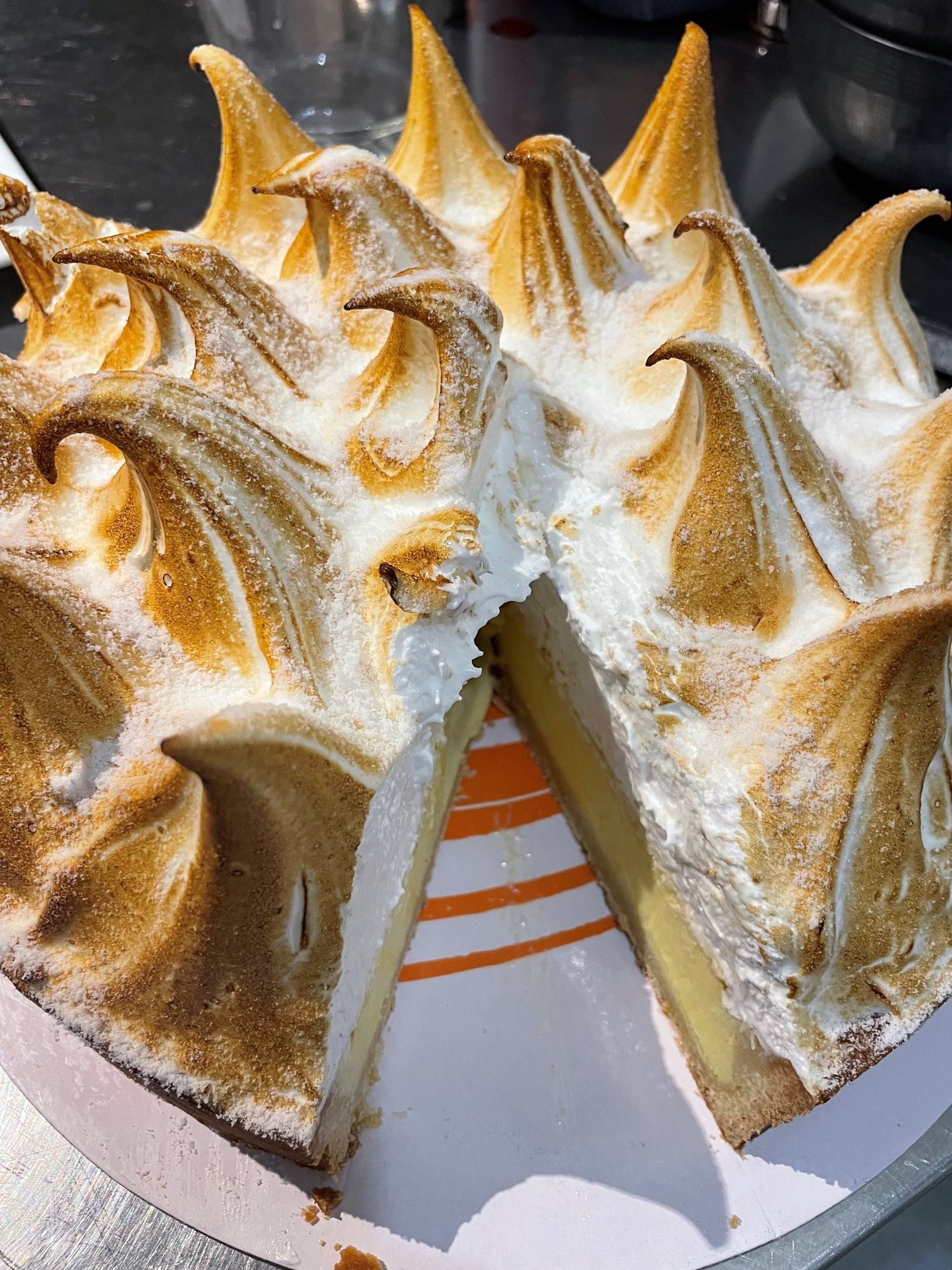 Lemon meringue pie with a slice taken out